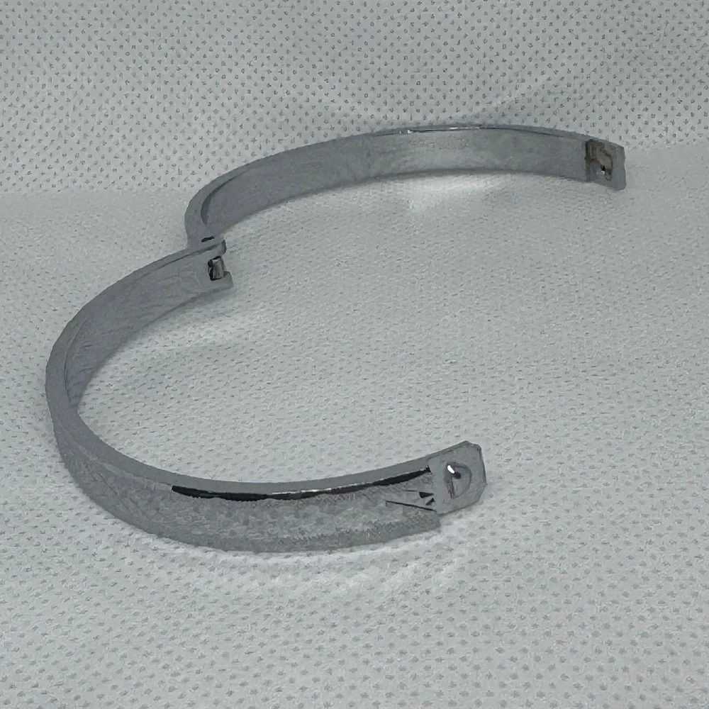 Silver Tone Hinged Bangle Bracelet with Etched Geometric Detail